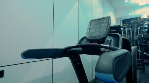 a gym with three seats and a mirror at Casablanca Elite in Jeddah