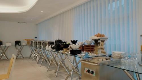 a room with a counter with a bunch of dishes at Casablanca Elite in Jeddah