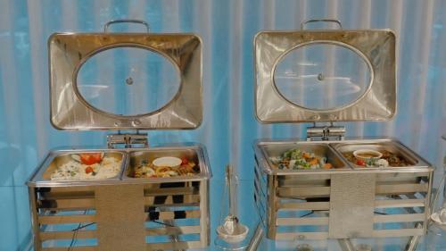 two metal trays with food inside of them at Casablanca Elite in Jeddah
