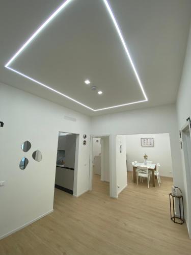 a white room with a table and a dining room at Mare Montenotte in Savona