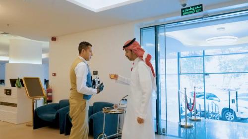 two men standing in a hospital room talking at Casablanca Elite in Jeddah