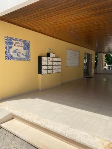 a large empty room with a wooden ceiling at 10 min walk to Rocha Beach in Portimão
