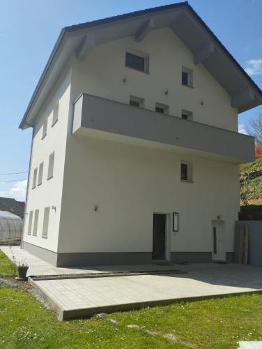 a large white building with a large window at RELAX in Kamnik