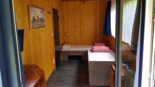 Ένα ή περισσότερα κρεβάτια σε δωμάτιο στο Ferienhaus Küsschen
