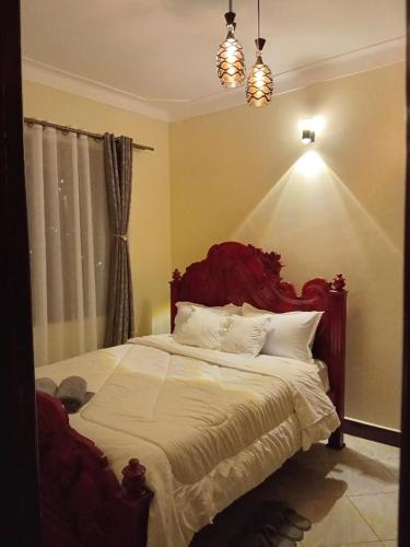 Una cama o camas en una habitación de Zuri Apartment