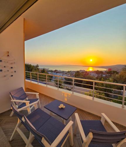 a balcony with chairs and a view of the ocean at La Marine Tabarka in Tabarka