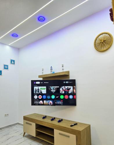 a room with a flat screen tv on a white wall at La Marine Tabarka in Tabarka