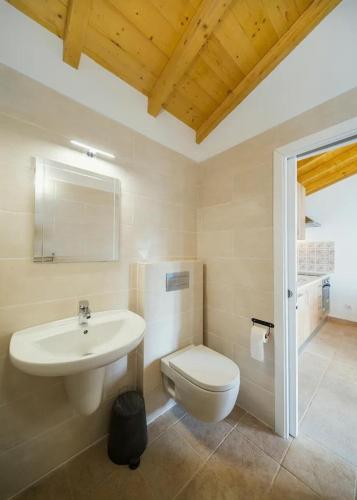 a bathroom with a sink and a toilet at One Bedroom Chalet with private bathroom and kitchen in Alcobaça
