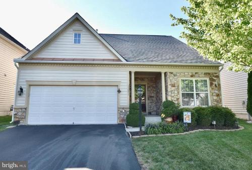 a house with a garage and a driveway at Ormond Dr 