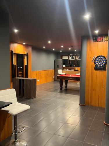 a room with a ping pong table and a pool table at Villa Ouro Verde in Gondomar