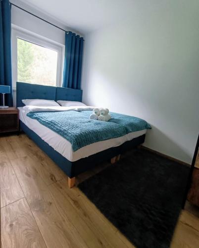 Postel nebo postele na pokoji v ubytování "Nad Sanem"