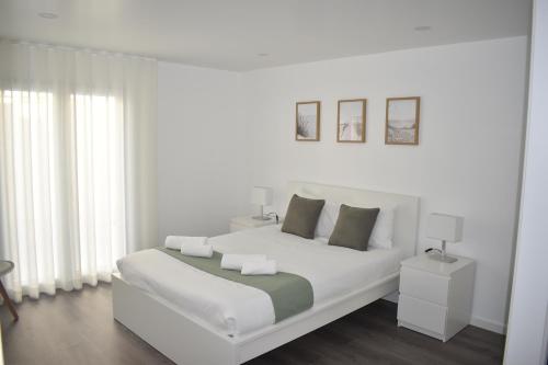 Ένα ή περισσότερα κρεβάτια σε δωμάτιο στο Casa do Sapateiro