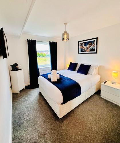 a bedroom with a large bed and a window at City Escape in Edinburgh