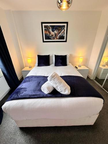 a bedroom with a bed with two pillows on it at City Escape in Edinburgh