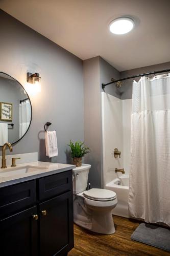 a bathroom with a toilet and a sink and a shower at Sunset Views & Mountain Getaway, 4 Min to Downtown in Mentone
