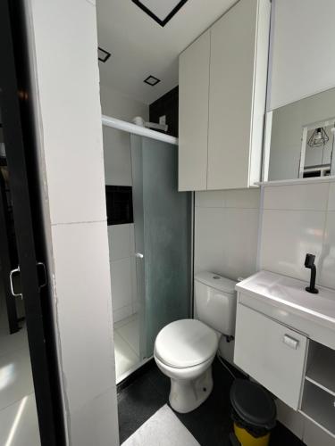 a small bathroom with a toilet and a sink at K Fofo - Aconchego no Centro in Rio de Janeiro