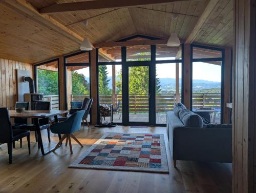 a living room with a couch and a table at Ferienhaus Enzo in Oberaichwald