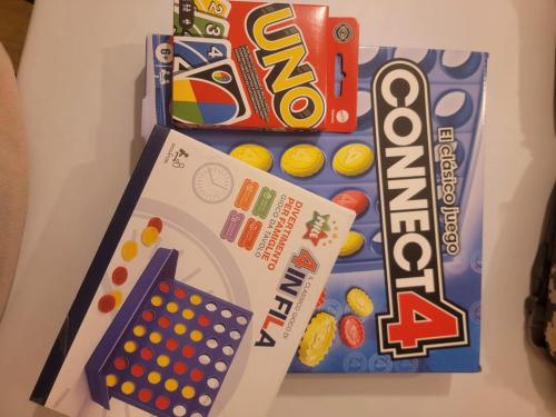 a refrigerator with a box of candy and a game at Papudo, Tus vacaciones soñadas!!! in Papudo