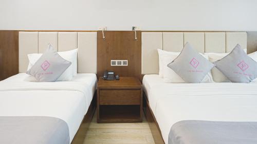 Paradise Hotel - Pool , Sky Lounge , Gym - Massage & Wellnessにあるベッド