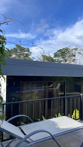 a building with a table in front of it at Residencia Esmeralda in Agua Buena