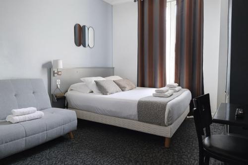 Postel nebo postele na pokoji v ubytování Hôtel du Parc Montsouris