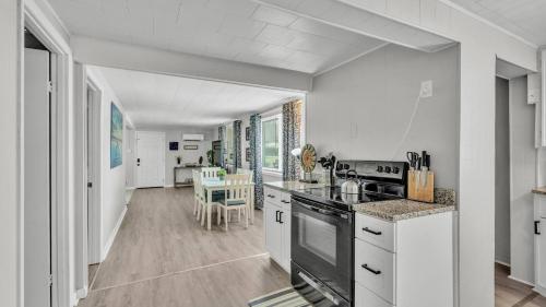 a kitchen with white counters and a stove top oven at Fall Break Specials! 4 Beds; Great for Lake Myrtle in Auburndale