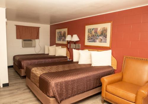 Ένα ή περισσότερα κρεβάτια σε δωμάτιο στο Auto Inn Motel & RV Park