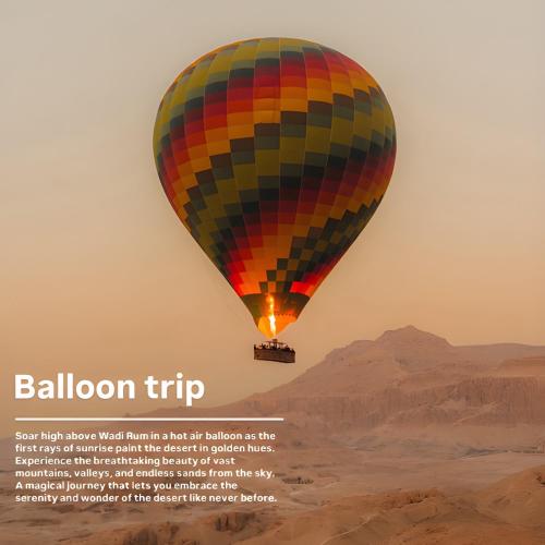 a hot air balloon flying over the desert at Sofia Valley Camp in Wadi Rum