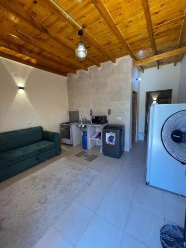 a living room with a couch and a refrigerator at Family House in Dahab