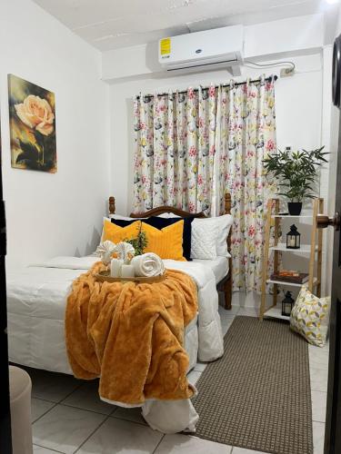 a bedroom with a bed with a blanket on it at Cozy Comfy Budget Friendly in San Fernando