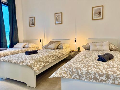 Katil atau katil-katil dalam bilik di WN Modern Apartments with Terrace Patio