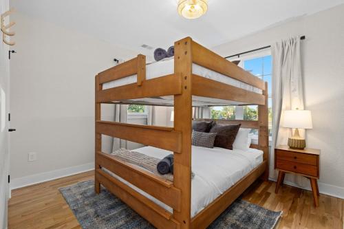 a bedroom with a bunk bed and a window at Denver 5BR Hot Tub, Pool Table, Ping Pong! in Denver