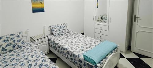 a small bedroom with a bed and a desk at hassan apartments in Sharm El Sheikh