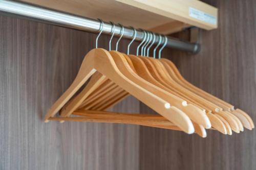 a bunch of wooden hangers on a shelf at Lambrusco in Kami-furano