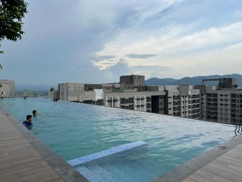 a swimming pool on the roof of a building at Youth City Residences by Manhattan Group in Nilai