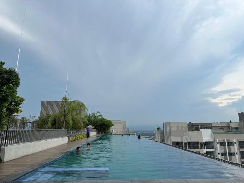 a large swimming pool on top of a building at Youth City Residences by Manhattan Group in Nilai
