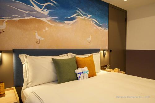 Una cama o camas en una habitación de Fullon Poshtel Penghu