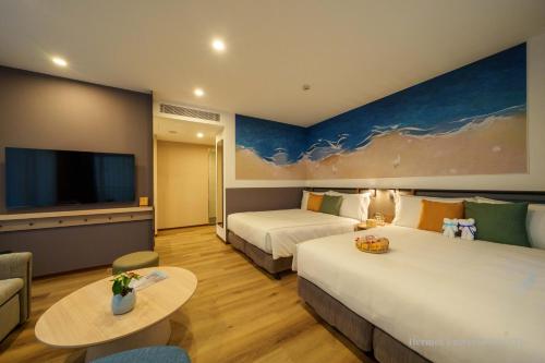 Una cama o camas en una habitación de Fullon Poshtel Penghu
