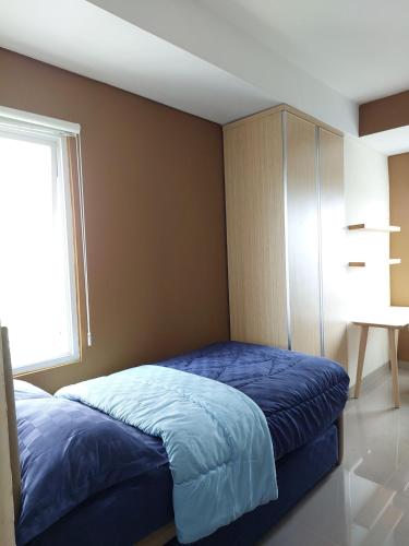 Postel nebo postele na pokoji v ubytování B residence apartment BSD cozy and nice