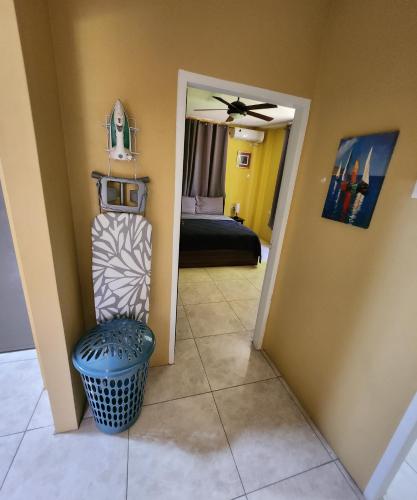 a hallway with a room with a bed and a chair at Carolina Point Resort in Crown Point