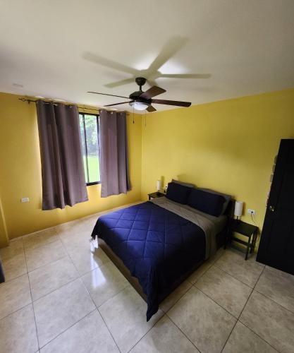 a bedroom with a bed and a ceiling fan at Carolina Point Resort in Crown Point