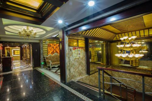 a lobby of a hotel with a chandelier at Grand Sun City Hotel-Located city center Metro Access in Changsha