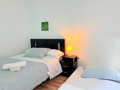 Postel nebo postele na pokoji v ubytování Lofthouse 14