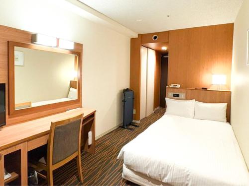 Ένα ή περισσότερα κρεβάτια σε δωμάτιο στο Hotel Abest Sapporo