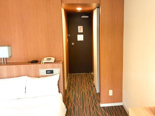 Ένα ή περισσότερα κρεβάτια σε δωμάτιο στο Hotel Abest Sapporo