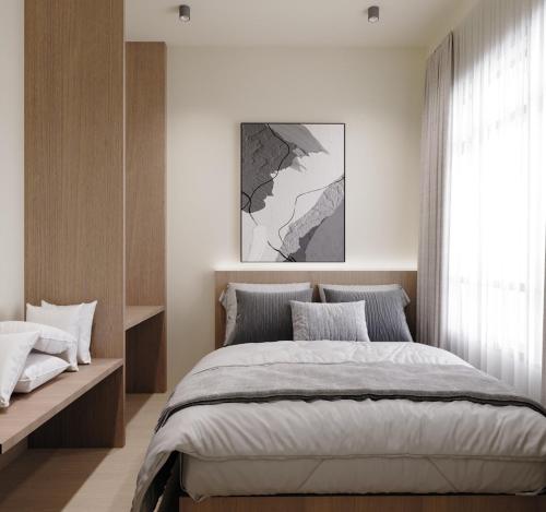 Postel nebo postele na pokoji v ubytování Blenz Hotel