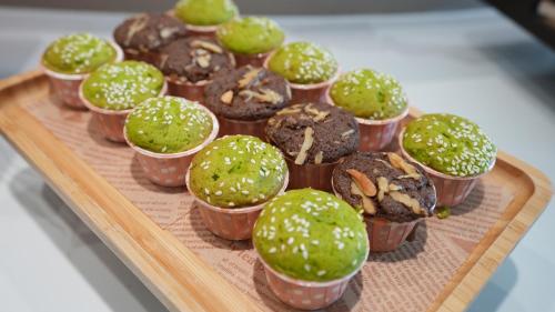 a bunch of donuts in paper cups on a tray at Dali Canghaixueyue Seaview Hotel in Dali