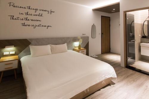 Ένα ή περισσότερα κρεβάτια σε δωμάτιο στο Yunhua B&B