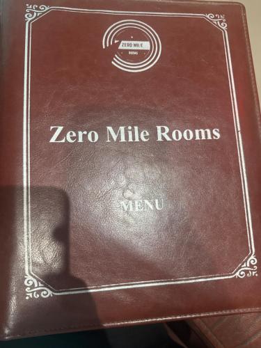 a brown box with the words zero mile rooms on it at Zero Mile Rooms in Begusarai