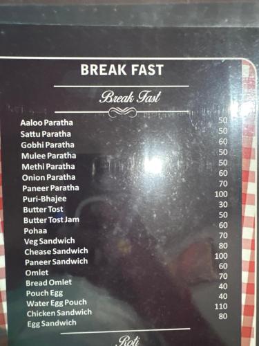 a menu for the breakfast fast food restaurant at Zero Mile Rooms in Begusarai